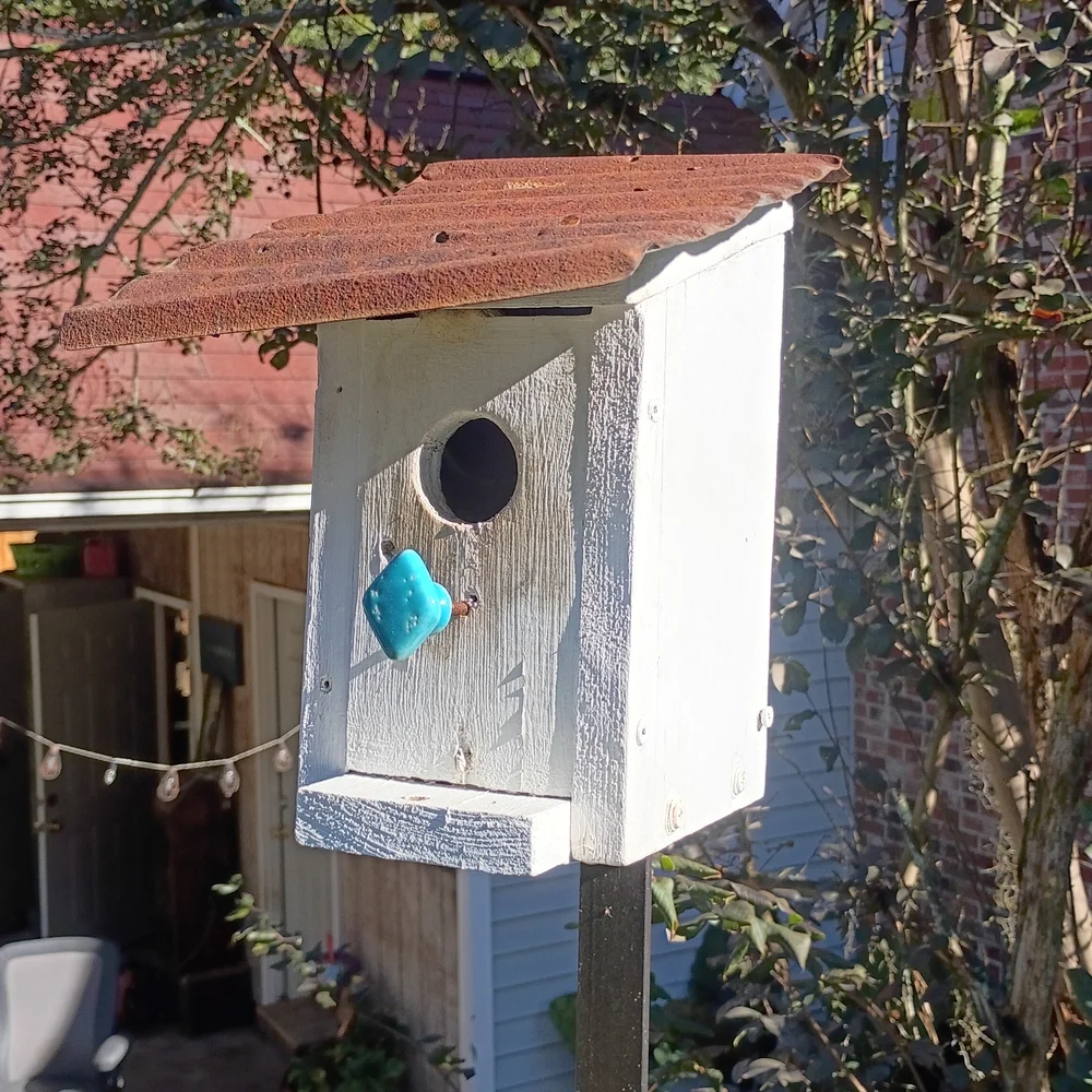 Rustic Birdhouse with Brown Roof and Blue Accent